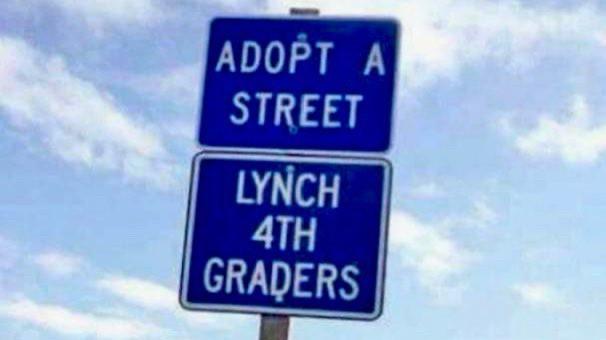 Stacked signs -- Adopt a Street/ Lynch 4th Graders