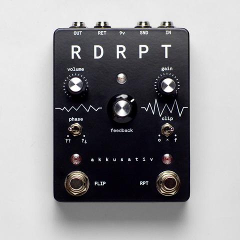 Photo. Top down view of the pedal on white background. Enclosure has a black matte powder coat with white artwork and markings on it.

IO, right to left: IN, SND, 9v, RET, OUT
Knobs, left to right, top to bottom: Volume, Gain, Feedback 
Switches: phase, clip
Footswitches: FLIP, RPT