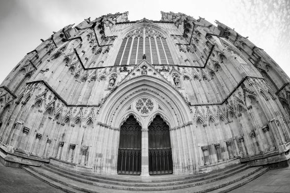 A black and white fisheye image of the facade of York Minster. York, England