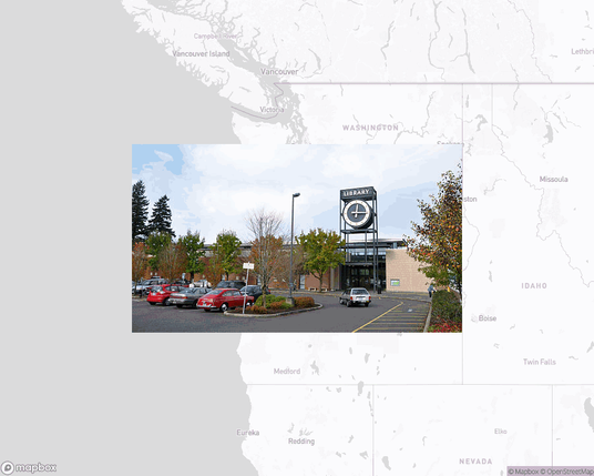 A photo of or from a library from the linked website, overlaid on a cropped world map where it's located.