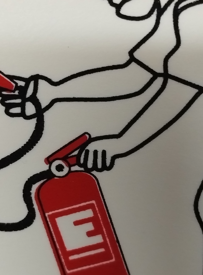 close up of hand pressing down the lower handle which is clearly wrong