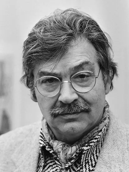 I don't know who they are, but the image appears to be a black-and-white portrait of a person with gray hair and glasses, wearing a patterned scarf and a light-colored jacket. If you have any questions about the content or context of the image, feel free to ask!

Image Credits: Wikimedia / Marcel Antonisse / Anefo / CC BY-SA 3.0 nl