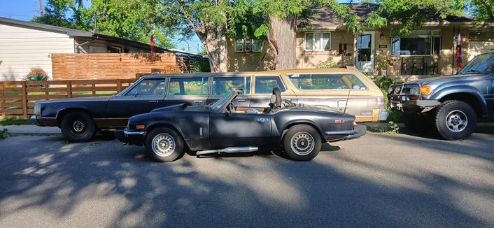 My lil thing in front of the 9 door Chrysler station wagon limo that lives down the street