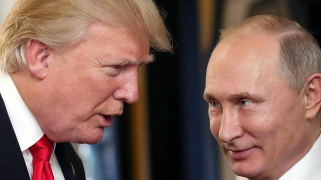 Donald Trump and Vladimir Putin at a conference in 2017 (EPA)