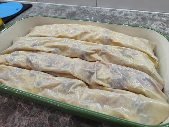 Cherry strudel in the tin ready to go into the oven.
