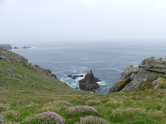 Rock which looks like a puffin, with Land's End to the left