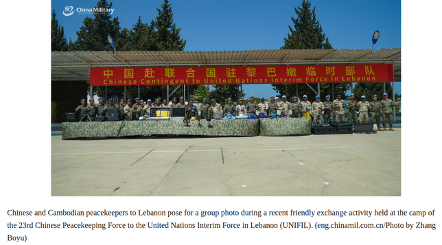 Chinese and Cambodian peacekeepers to Lebanon pose for a group photo during a recent friendly exchange activity held at the camp of the 23rd Chinese Peacekeeping Force to the United Nations Interim Force in Lebanon (UNIFIL). (eng.chinamil.com.cn/Photo by Zhang Boyu)