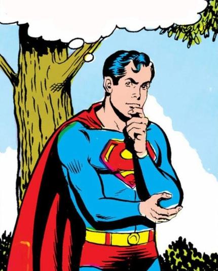 Image tirée d'un comic book. Superman (un homme blanc, cheveux noirs avec une petit boucle sur le front, portant un costume moulant bleu à cape rouge) est debout, se tenant le menton avec l'index et le pouce de la main gauche, sa main droit soutenant son coude gauche. Une bulle de pensée est présente sur l'image, vide