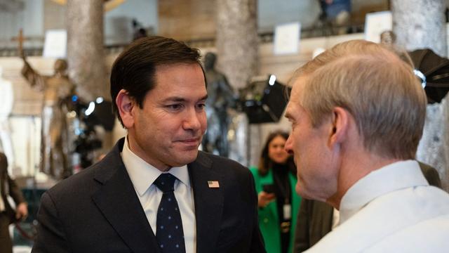 Secretary of State Marco Rubio (face to camera) talks with Rep. Jim Jordan (back to camera)