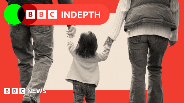 An image of a family of three walking together, holding hands with child in the middle.