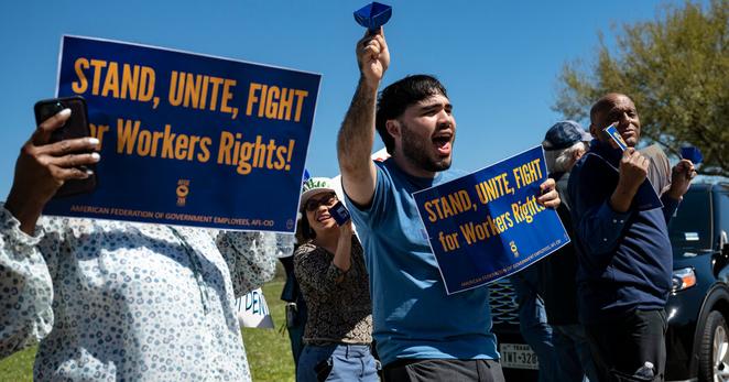 Protesters outside the NASA Johnson Space Center in Houston rallied in March to protect the jobs of embattled federal workers.