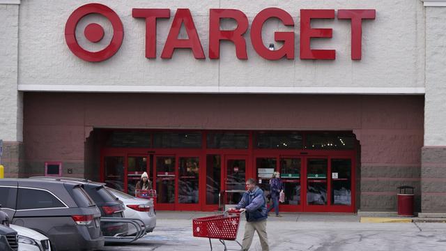 A shopper wheels a cart through the parking lot after making a purchase at the Target store, Monday, Feb. 27, 2023, in Salem, N.H. Target is recalling almost 5 million candles over laceration and burn hazards, according to a Thursday notice published by the U.S. Consumer Product Safety Commission.(AP Photo/Charles Krupa, File) A shopper wheels a cart through the parking lot after making a purchase at the Target store, Monday, Feb. 27, 2023, in Salem, N.H. Target is recalling almost 5 million candles over laceration and burn hazards, according to a Thursday notice published by the U.S. Consumer Product Safety Commission.(AP Photo/Charles Krupa, File)