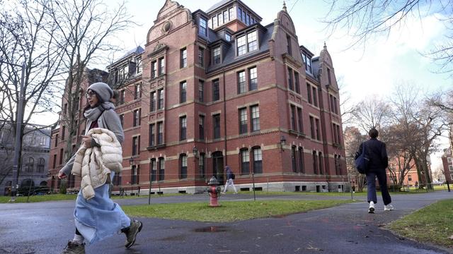 People walk between buildings, Dec. 17, 2024, on the campus of Harvard University in Cambridge, Mass. (AP Photo/Steven Senne, File)