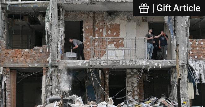 Kyiv residents took stock of the damage on Sunday following a Russian drone strike.