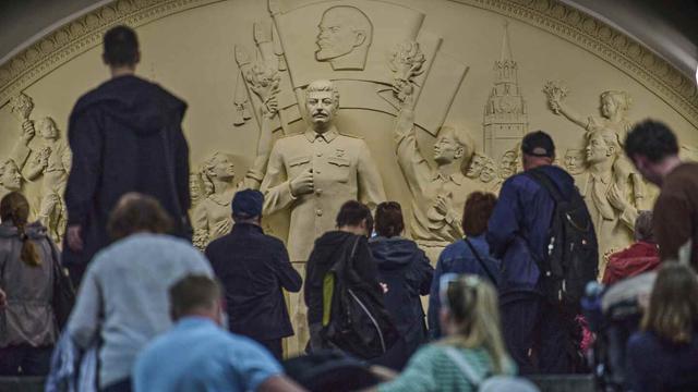 Passengers walk in front of a monument to Soviet leader Josef Stalin at the Taganskaya subway station in Moscow, Russia, on Wednesday, May 21, 2025. (AP Photo/Alexander Zemlianichenko, File)