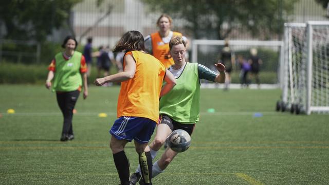 Players in actions during an inclusive six a side soccer friendly tournament in London, Sunday, June 1, 2025. (AP Photo/Alastair Grant)