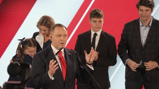 Presidential candidate Karol Nawrocki, a conservative historian backed by the right-wing Law and Justice party addresses supporters at his headquarters after the presidential election runoff in Warsaw, Poland, Sunday, June 1, 2025.