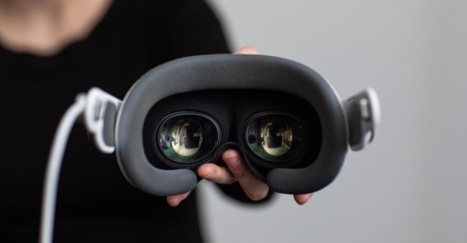 Someone holding the Apple Vision Pro headset towards the camera.