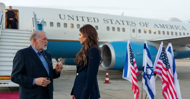 Ambassador Mike Huckabee speaking with Homeland Security Secretary Kristi Noem at Ben Gurion Airport in Tel Aviv in May.