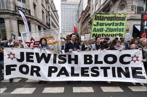 Protestors carry a banner reading, "Jewish Bloc for Palestine" at the front of a march. (Photo courtesy of Jewish Anti-Zionist Congress)