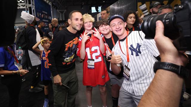 Michael Rubin (L) poses with fans during the Fanatics Fest NYC 2024 at Jacob Javits Center Michael Rubin (L) poses with fans during the Fanatics Fest NYC 2024 at Jacob Javits Center