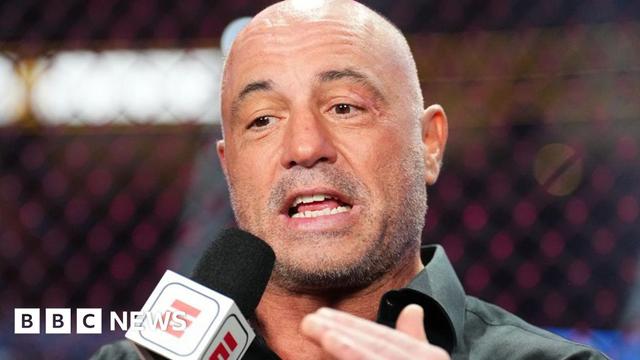 Joe Rogan speaking into a microphone