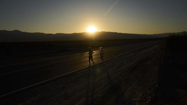 Danny Westergaard, left, runs with pacing help from daughter Madison Westergaard as the sun rises during the Badwater 135 Ultramarathon, Tuesday, July 8, 2025, in Death Valley National Park, Calif. (AP Photo/John Locher) Danny Westergaard, left, runs with pacing help from daughter Madison Westergaard as the sun rises during the Badwater 135 Ultramarathon, Tuesday, July 8, 2025, in Death Valley National Park, Calif. (AP Photo/John Locher)