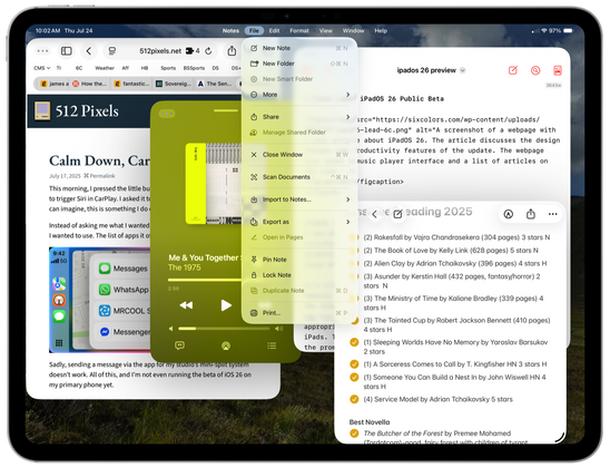Screenshot of a tablet displaying a webpage, a note-taking app, and a music player.