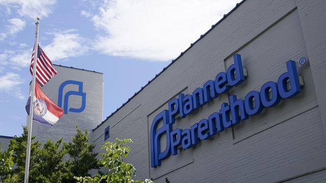 A Missouri and American flag fly outside Planned Parenthood in St. Louis, June 24, 2022. (AP Photo/Jeff Roberson, File)