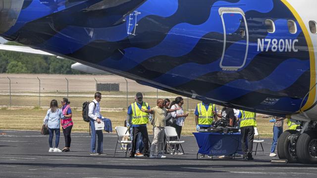 Democratic lawmakers board a plane at Signature Aviation at the South Terminal, Sunday, Aug. 3, 2025, in Austin, Texas. (Aaron E. Martinez/Austin American-Statesman via AP)