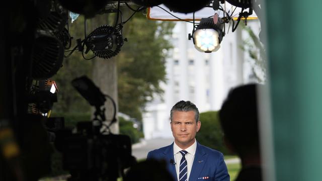 Defense Secretary Pete Hegseth prepares to give a television interview outside the White House Thursday, Aug. 7, 2025, in Washington. (AP Photo/Mark Schiefelbein)