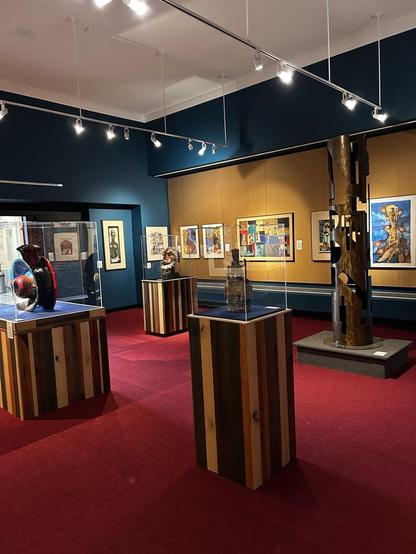 A room with a variety of 2-D and 3-D artworks 