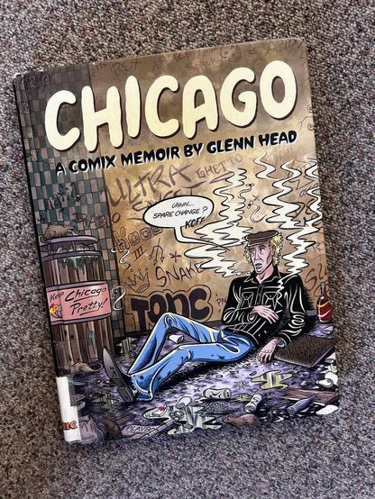 Book cover: CHICAGO
A COMIX MEMOIR BY GLENN HEAD

Illustration of a person sitting in an alley wearing a black jacket and blue jeans, surrounded by empty beer cans, smoking a cig, saying "Uhhh, spare change?"
