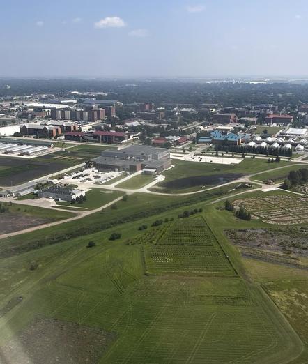 Aerial view of part of a campus and surrounding area.