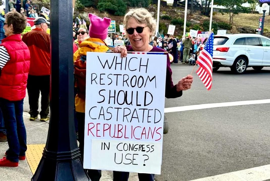 A sign from yesterday's No Kings events saying, "Which restroom should castrated Republicans in Congress use?"