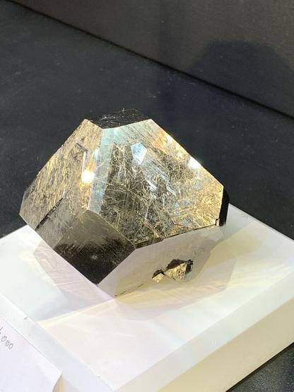 A several cm metallic crystal with octahedral and cubic faces