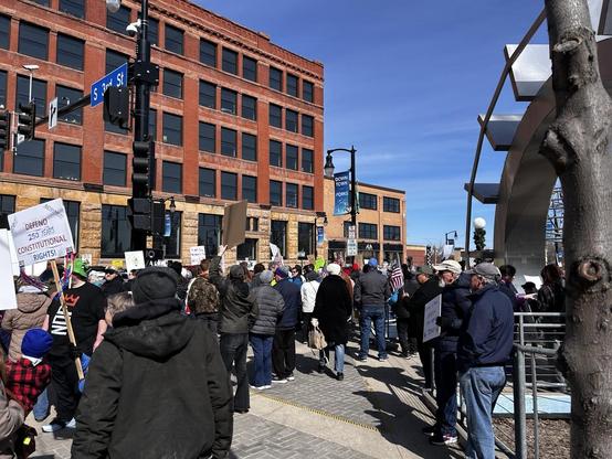 People protesting along a street 