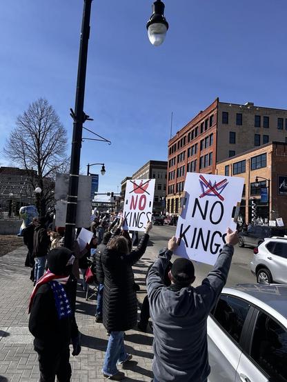 People protesting along a street 