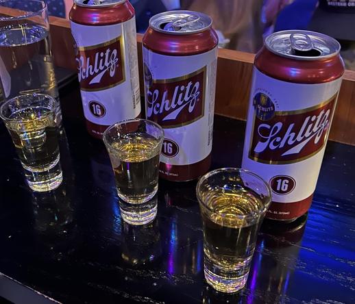 Three shots of MALÖRT and three cans of Schlitz beer