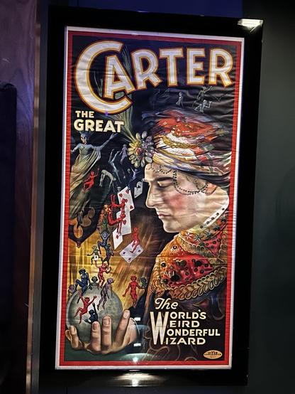 Vintage poster of The Great Carter, the "world's weird wonderful wizard" with image of a man holding an orb and looking down at it. Small figures and playing cards float in the scene.