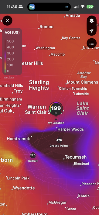 Screenshot of map of SE Michigan showing my location in Eastpointe with a 199 micrograms per cubic meter (a.k.a.AQI, ) and an ominous blob due south of me 2 shades darker over Grosse Pointe, Detroit, and Windsor ON, CA. The legend seems to say that blob scores around 500 micrograms per cubic meter.