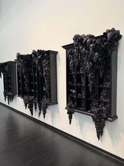 All three parts of the artwork, all painted black.